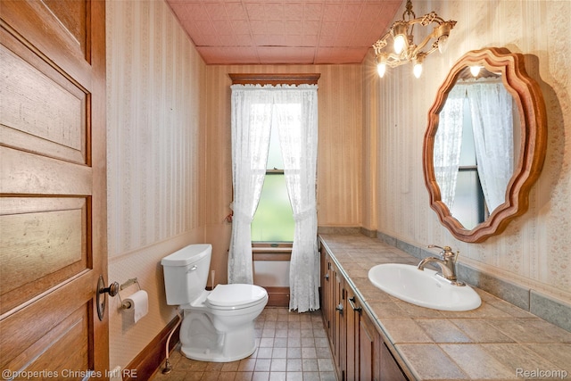 407 Westminister St, Marine City, MI 48039 - half bath with wallpapered walls, toilet, vanity, and a chandelier