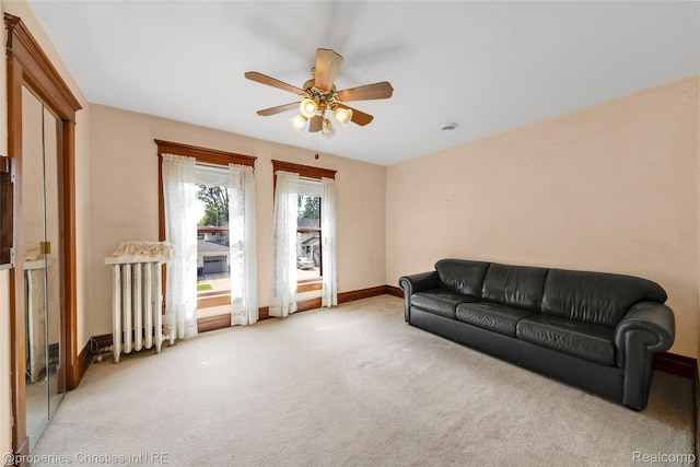 407 Westminister St, Marine City, MI 48039 - living room with ceiling fan, light colored carpet, baseboards, and radiator