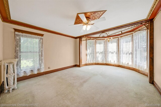 407 Westminister St, Marine City, MI 48039 - empty room featuring carpet, ceiling fan, baseboards, and crown molding
