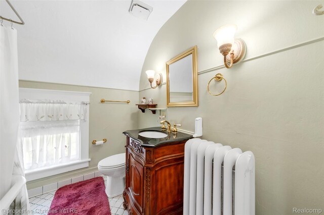 407 Westminister St, Marine City, MI 48039 - full bath with radiator heating unit, toilet, lofted ceiling, vanity, and tile patterned floors