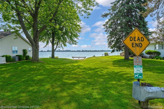 407 Westminister St, Marine City, MI 48039 - view of green lawn with a water view and cooling unit