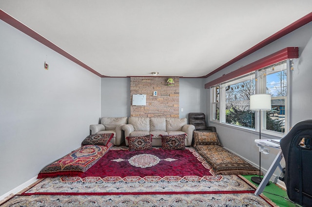 living room with crown molding and baseboards