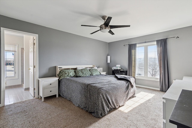 bedroom with carpet flooring, ceiling fan, and baseboards