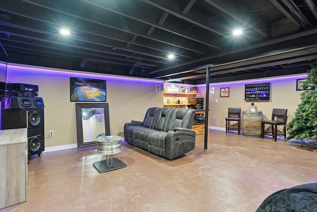 living room with finished concrete flooring and baseboards