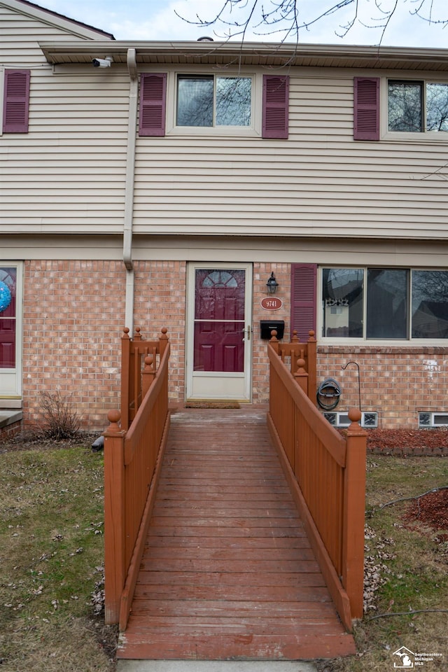 view of property featuring brick siding