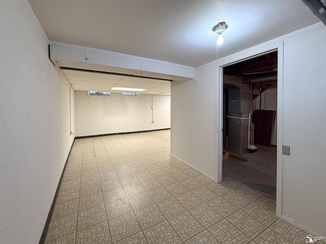 empty room with light floors and baseboards