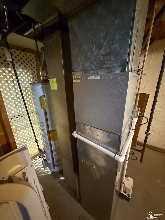 utility room featuring gas water heater