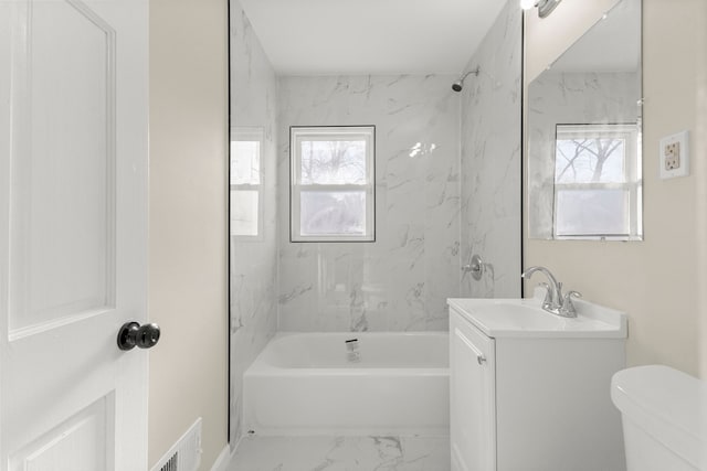 full bathroom featuring visible vents, plenty of natural light, marble finish floor, and vanity