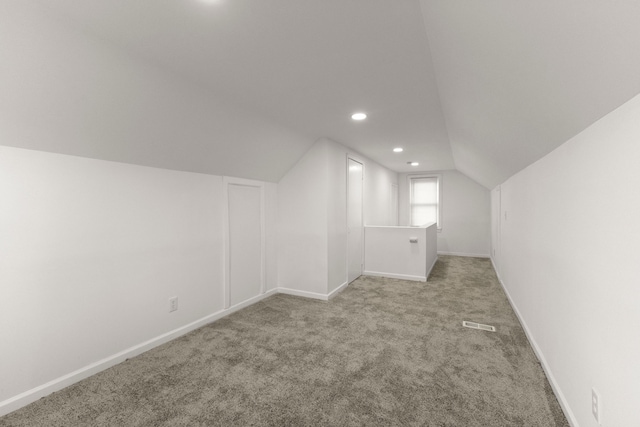 bonus room with baseboards, carpet floors, visible vents, recessed lighting, and vaulted ceiling