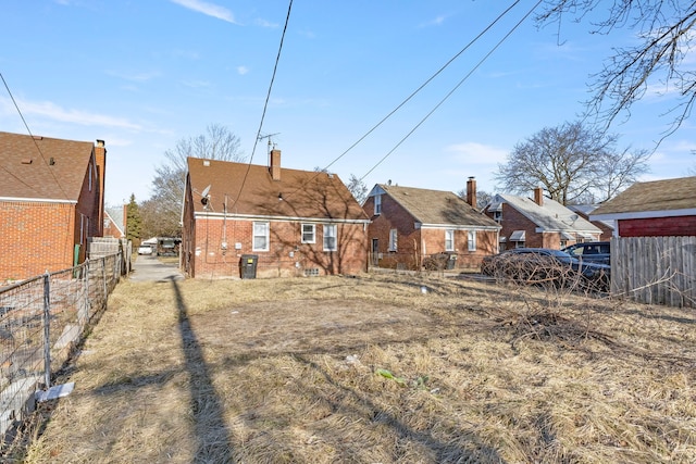 back of property with fence