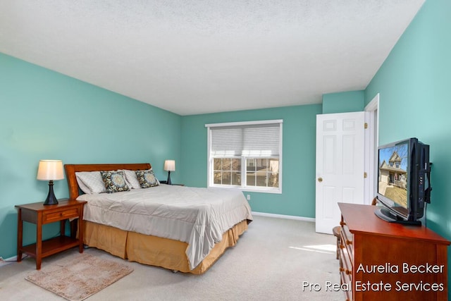 carpeted bedroom featuring baseboards