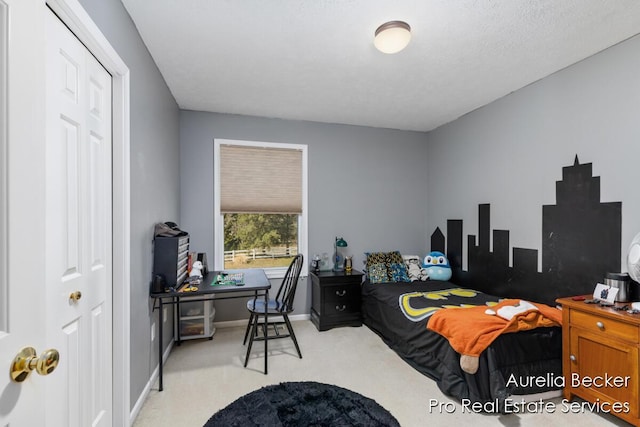 bedroom featuring light carpet and baseboards