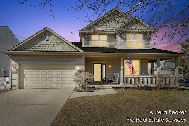 view of front of house with covered porch, concrete driveway, and an attached garage