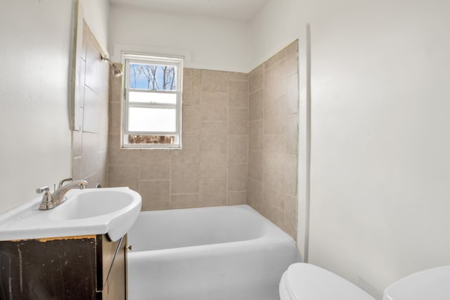 full bathroom featuring tub / shower combination, toilet, and vanity