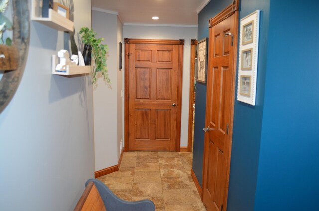 hall with stone finish flooring, recessed lighting, baseboards, and ornamental molding