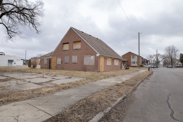 exterior space featuring brick siding