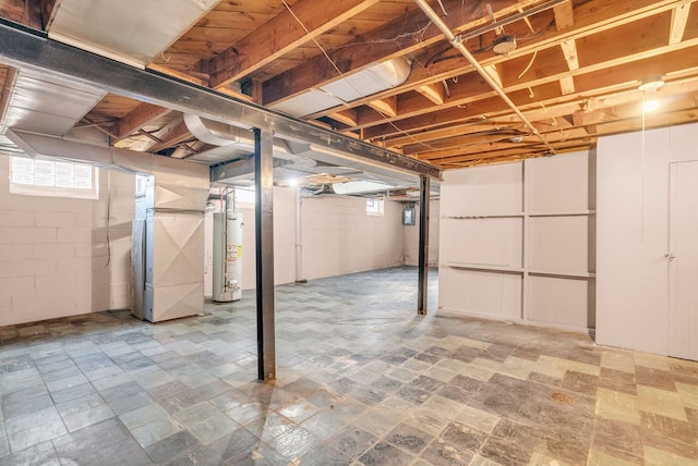 basement featuring gas water heater and heating unit