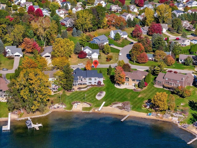 birds eye view of property with a residential view and a water view