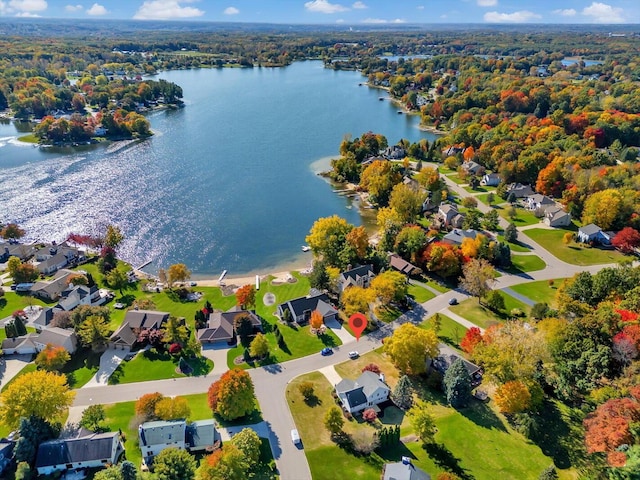 drone / aerial view with a residential view and a water view