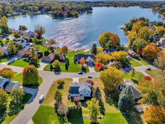 birds eye view of property with a residential view and a water view