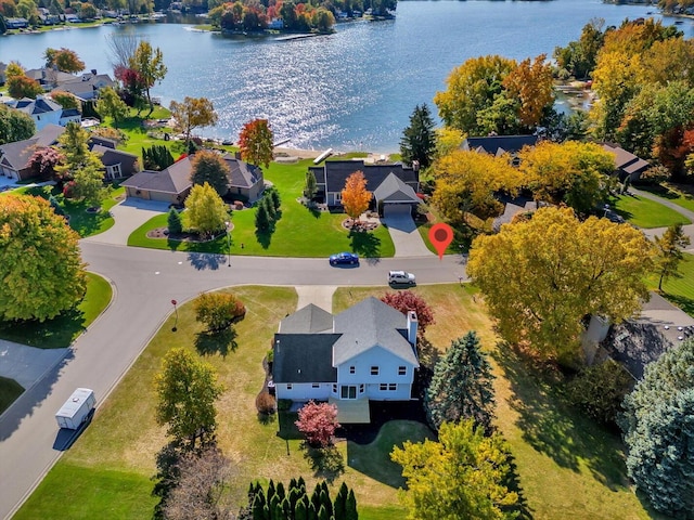 birds eye view of property featuring a residential view and a water view