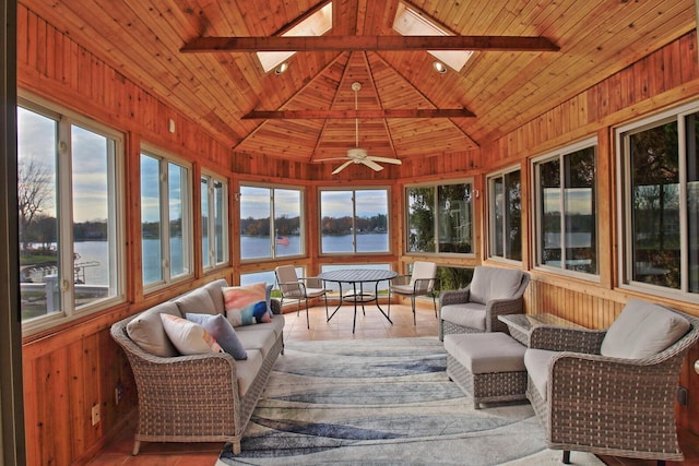 sunroom featuring wood ceiling, a water view, and a healthy amount of sunlight