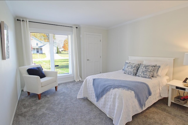 carpeted bedroom with baseboards and ornamental molding