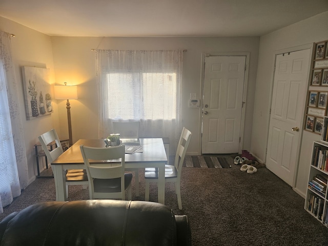 view of carpeted dining space