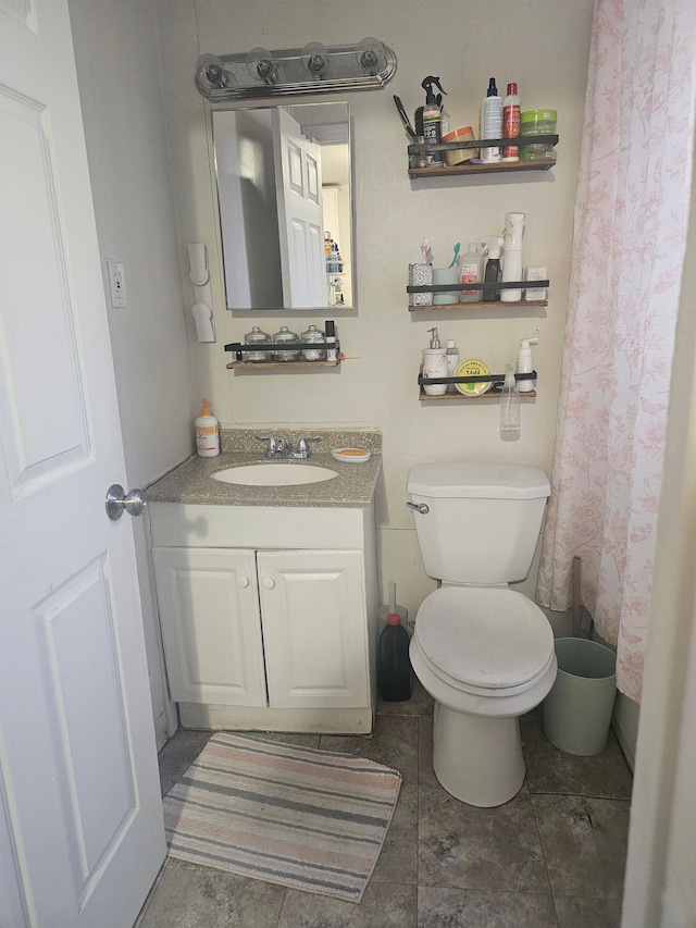 full bathroom featuring vanity and toilet