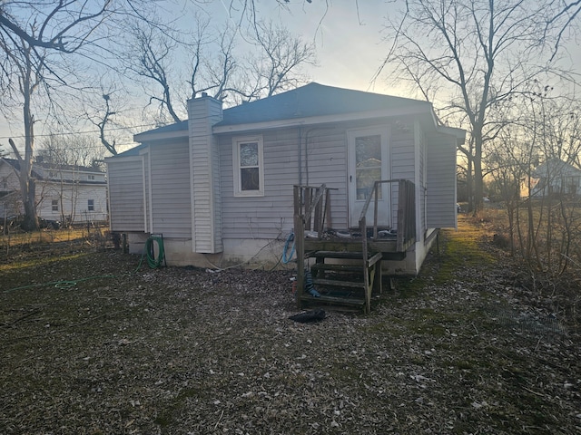 rear view of house with a chimney