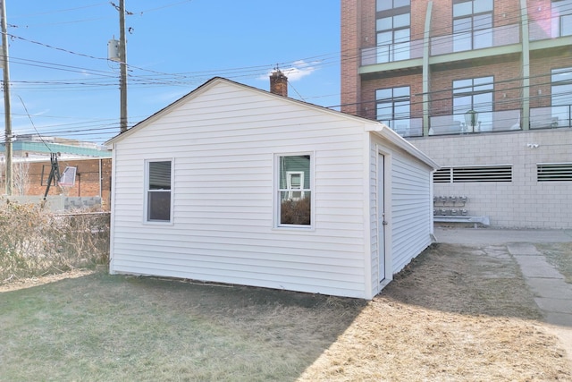 view of side of property featuring fence