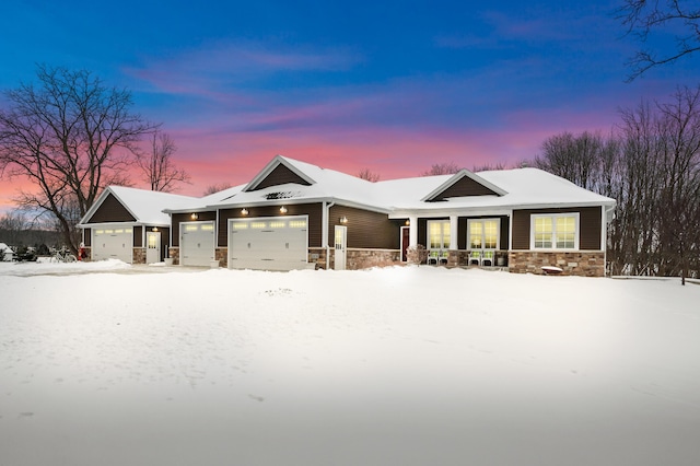 view of front of home with stone siding and an attached garage