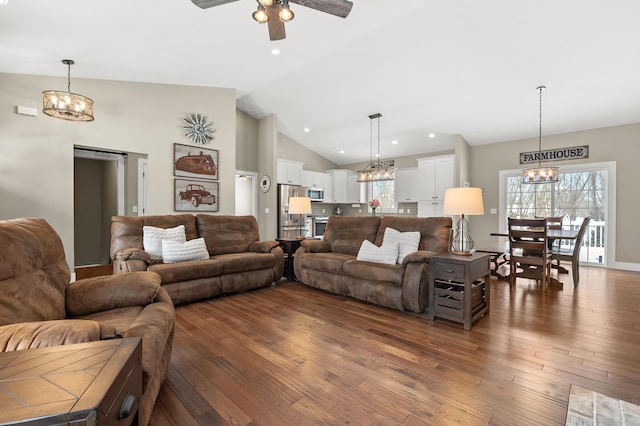 living area featuring recessed lighting, ceiling fan with notable chandelier, high vaulted ceiling, and wood-type flooring