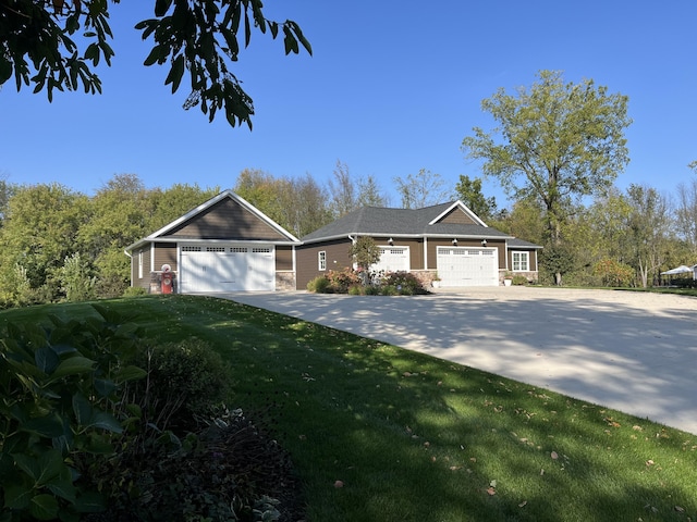 view of front of house featuring concrete driveway and a front yard