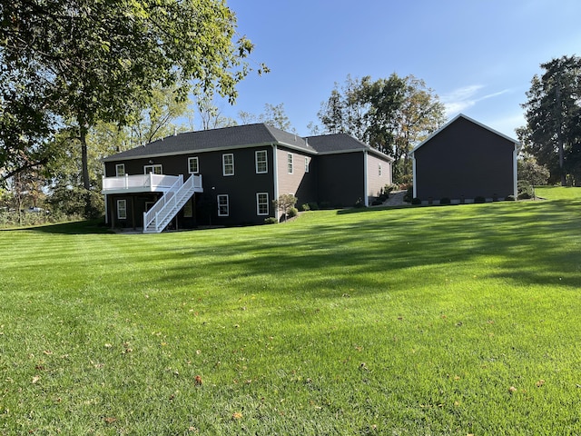 view of yard with a deck and stairway