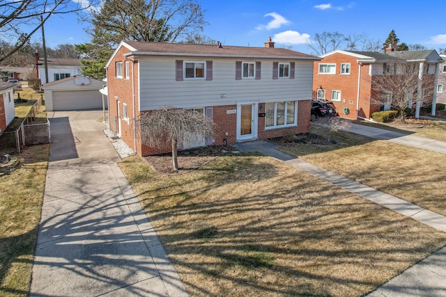 view of front of home with an outbuilding, fence, a front yard, brick siding, and a chimney