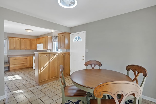 dining space with baseboards