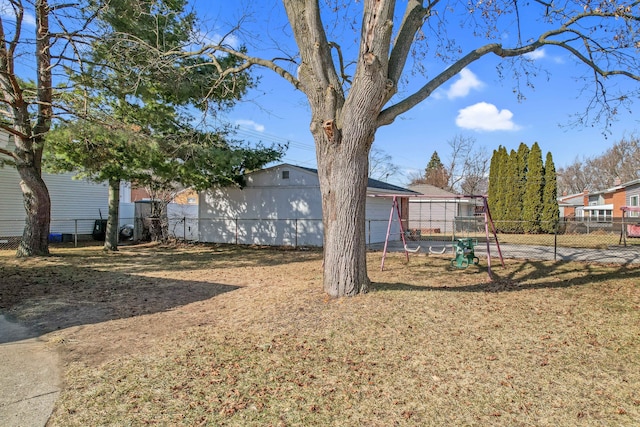 view of yard with a playground and fence