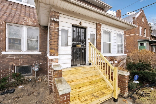 entrance to property with brick siding