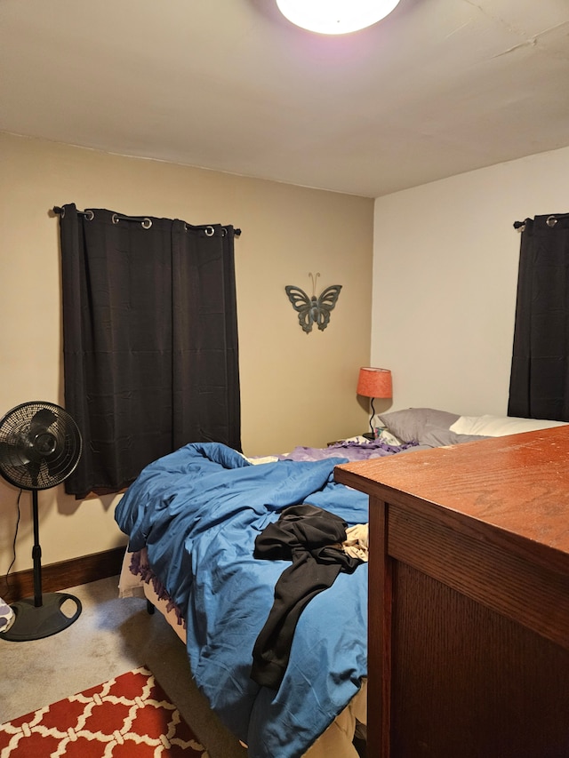 carpeted bedroom with baseboards