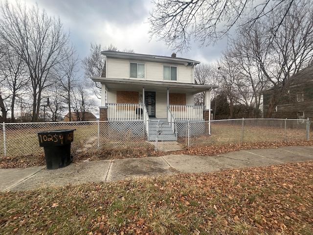 view of front of property featuring a fenced front yard, a porch, a chimney, and a gate