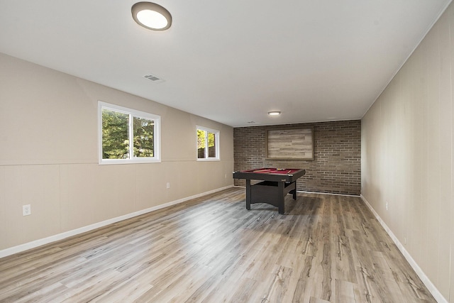 game room featuring visible vents, billiards, light wood-style floors, brick wall, and baseboards