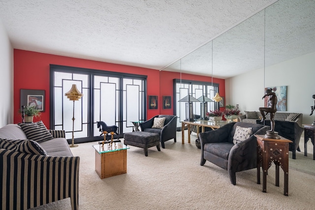 living area with a textured ceiling and carpet floors