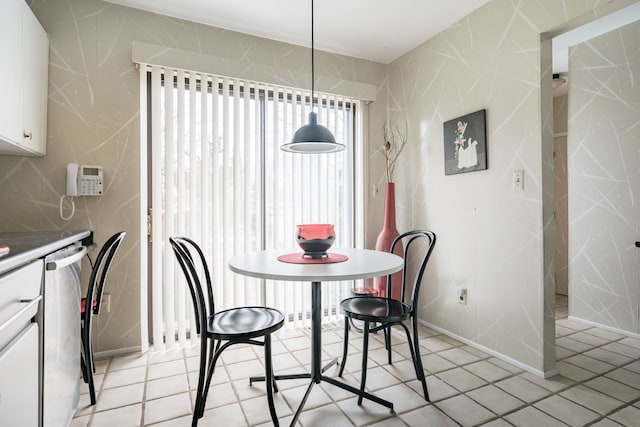 dining room featuring tile walls