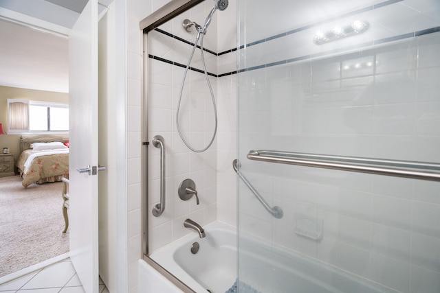 full bath with tile patterned flooring, ensuite bathroom, and shower / bath combination with glass door