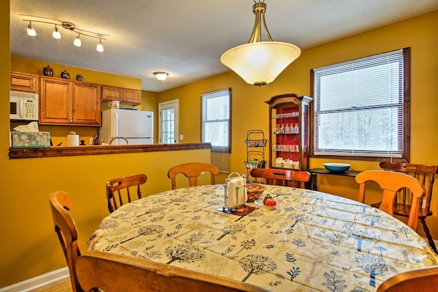 dining space with baseboards