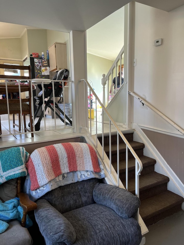 living room featuring stairway and baseboards