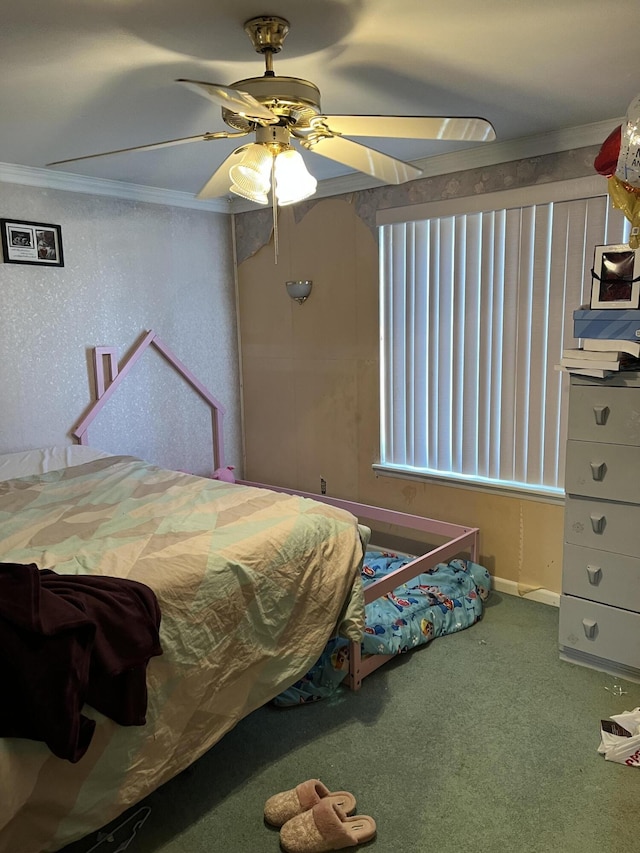 bedroom with a ceiling fan, ornamental molding, and carpet flooring