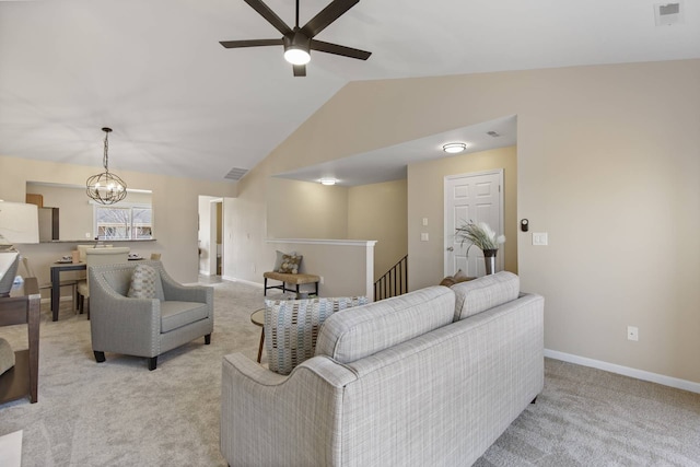 living area featuring visible vents, baseboards, light colored carpet, vaulted ceiling, and ceiling fan with notable chandelier