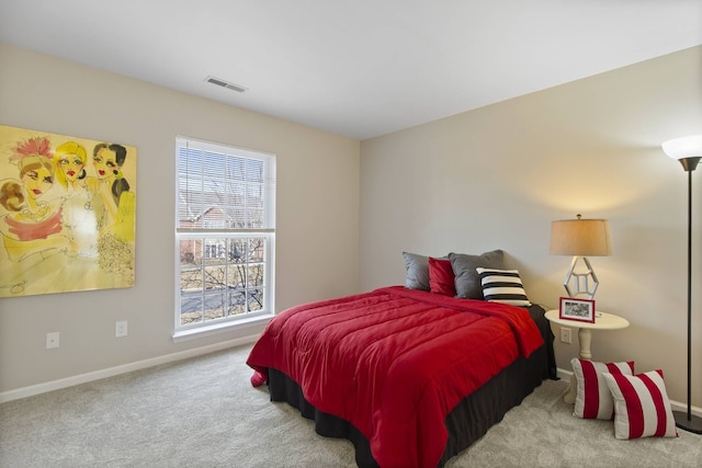 bedroom with visible vents, baseboards, and carpet